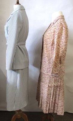 Lot 42 - Two c.1970's skirt suits, including a navy and...