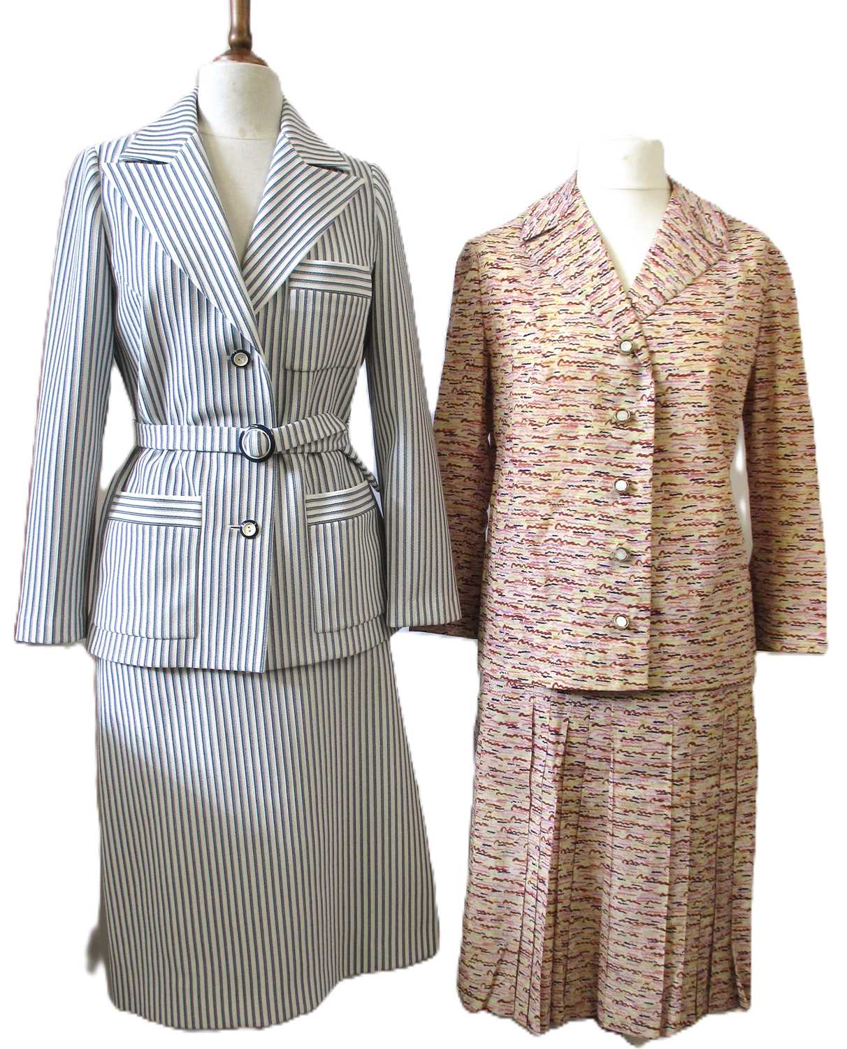 Lot 42 - Two c.1970's skirt suits, including a navy and...