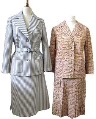 Lot 42 - Two c.1970's skirt suits, including a navy and...