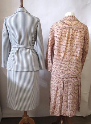 Lot 42 - Two c.1970's skirt suits, including a navy and...