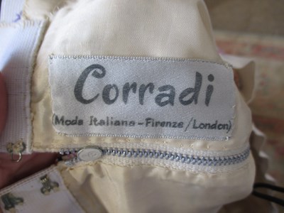 Lot 42 - Two c.1970's skirt suits, including a navy and...