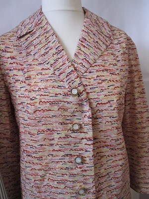 Lot 42 - Two c.1970's skirt suits, including a navy and...