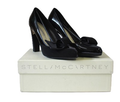 Lot 173 - Stella McCartney: a pair of black and gold...