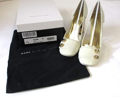 Lot 174 - Marc by March Jacobs: a pair of cream and gold...