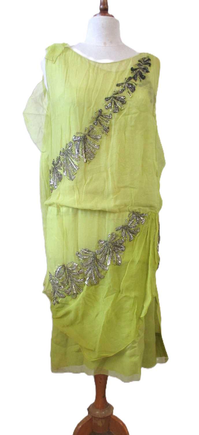 Lot 7 - A 1920's beaded dress, the double layer...
