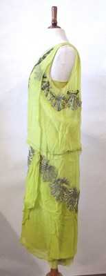 Lot 7 - A 1920's beaded dress, the double layer...