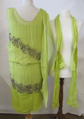 Lot 7 - A 1920's beaded dress, the double layer...
