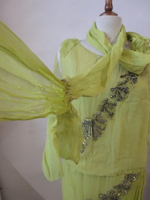 Lot 7 - A 1920's beaded dress, the double layer...
