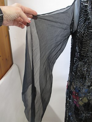 Lot 8 - A 1920's beaded dress, in fine black net with...