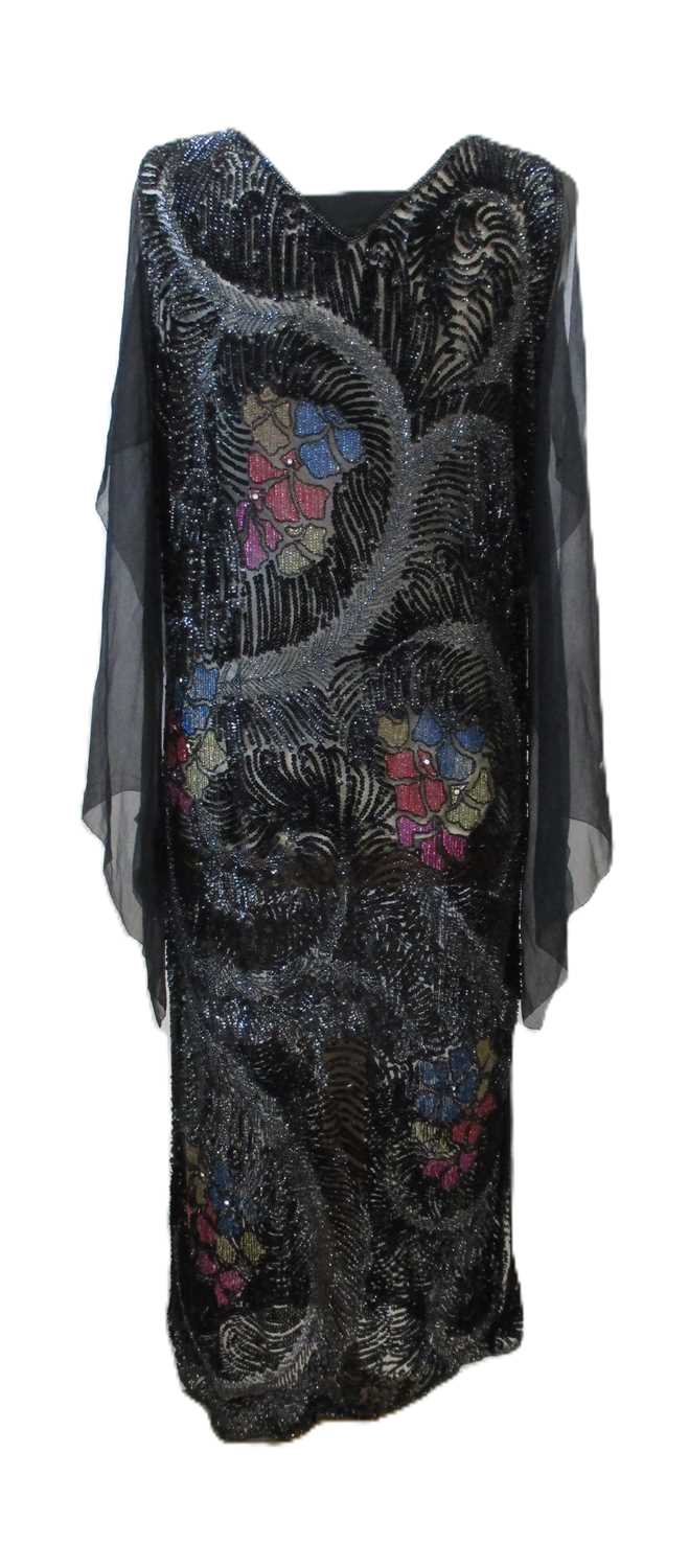 Lot 8 - A 1920's beaded dress, in fine black net with...