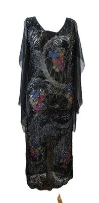 Lot 8 - A 1920's beaded dress, in fine black net with...