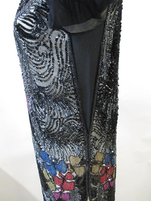 Lot 8 - A 1920's beaded dress, in fine black net with...