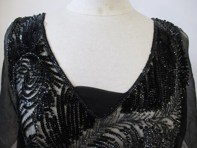 Lot 8 - A 1920's beaded dress, in fine black net with...