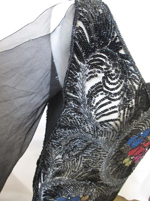Lot 8 - A 1920's beaded dress, in fine black net with...