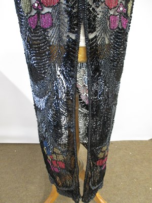 Lot 8 - A 1920's beaded dress, in fine black net with...