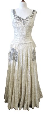 Lot 13 - A 1930/40's lace dress, the sleeveless cream...