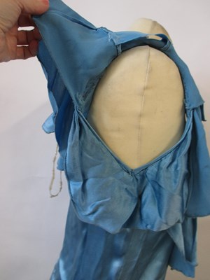 Lot 10 - A 1930's blue satin dress, with rounded...