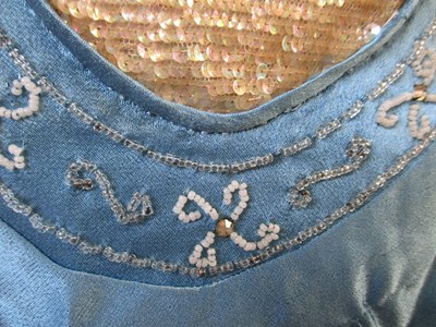 Lot 10 - A 1930's blue satin dress, with rounded...