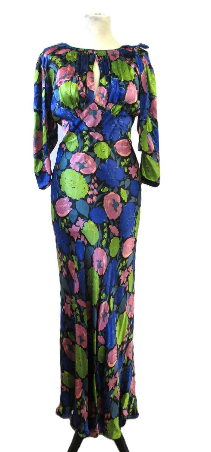 Lot 12 - A 1930's floral satin dress, with rounded...