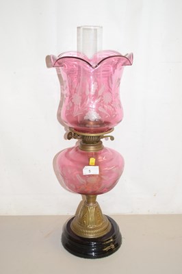 Lot 5 - Late 19th Century oil lamp with pink tinted...
