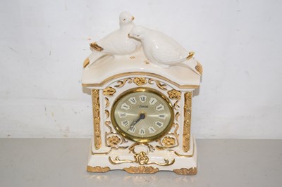 Lot 48 - A Kamini porcelain cased mantel clock with...