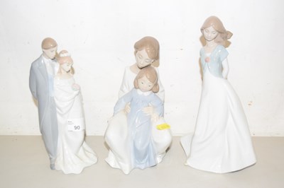 Lot 90 - A group of three Nao porcelain figures