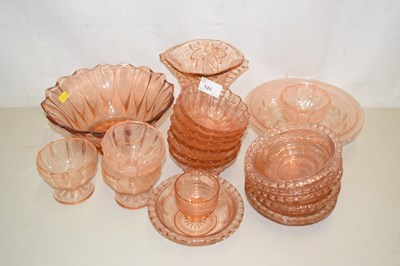 Lot 144 - A collection of vintage peach glass bowls,...