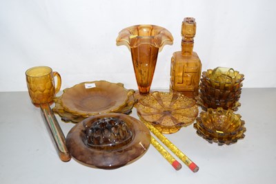 Lot 165 - A collection of amber glass wares to include...