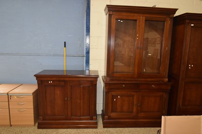 Lot 212 - A modern two piece display cabinet with glazed...