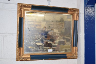 Lot 241 - A modern wall mirror in gilt and blue finish...