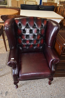 Lot 270 - A red leather upholstered armchair