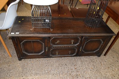 Lot 274 - A Jacobean Revival oak side cabinet with two...