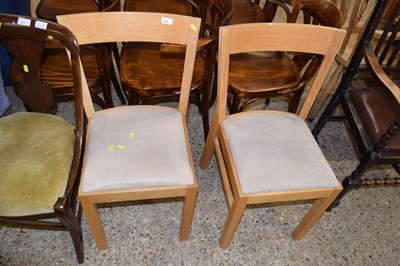 Lot 278 - A pair of light oak dining chairs