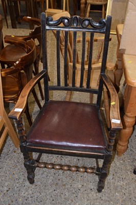 Lot 279 - An oak carver chair with slat back