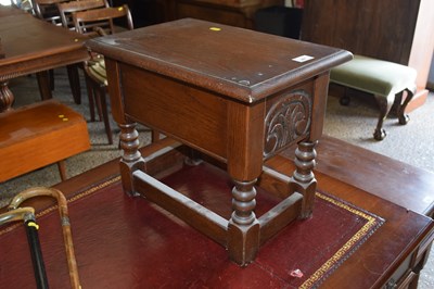 Lot 287 - A small oak box stool with carved detail