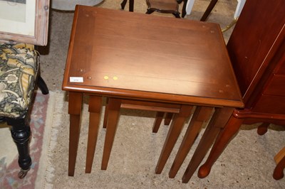 Lot 315 - A nest of three dark wood tables