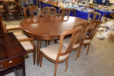Lot 320 - A modern dark wood extending dining table and...