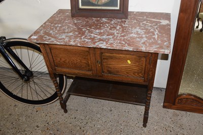 Lot 331 - A small oak wash stand on barley twist legs