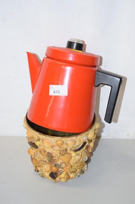 Lot 670 - A vintage enamel kettle and a shell decorated...