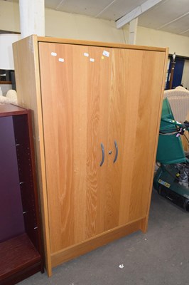 Lot 780 - Modern light oak finish two door cupboard