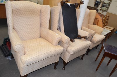 Lot 795 - Set of three wing back armchairs and an...