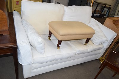 Lot 802 - A cream two seater sofa