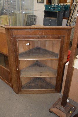 Lot 808 - A 19th Century oak corner cabinet with glazed...