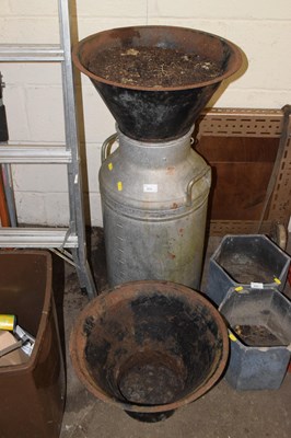 Lot 834 - A milk churn and two iron planters