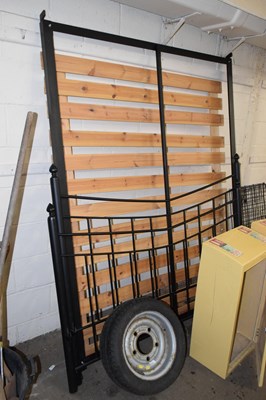 Lot 838 - A modern black painted iron double bed frame...