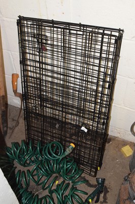 Lot 843 - Folding dog cage and a coiled hose (2)