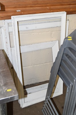 Lot 864 - A group of four white painted picture frames