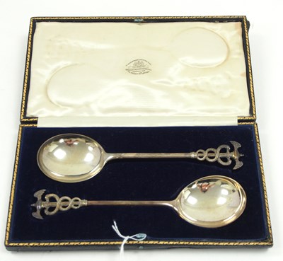 Lot 86 - A cased pair of George V silver serving spoons...