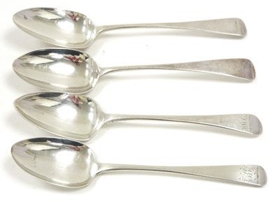 Lot 108 - A group of four Georgian silver serving spoons,...