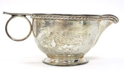 Lot 173 - A George V silver milk jug of compressed...